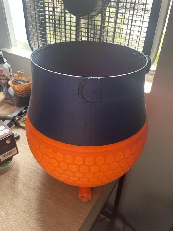 3D-printed prototype with honeycomb texture and embossed logo