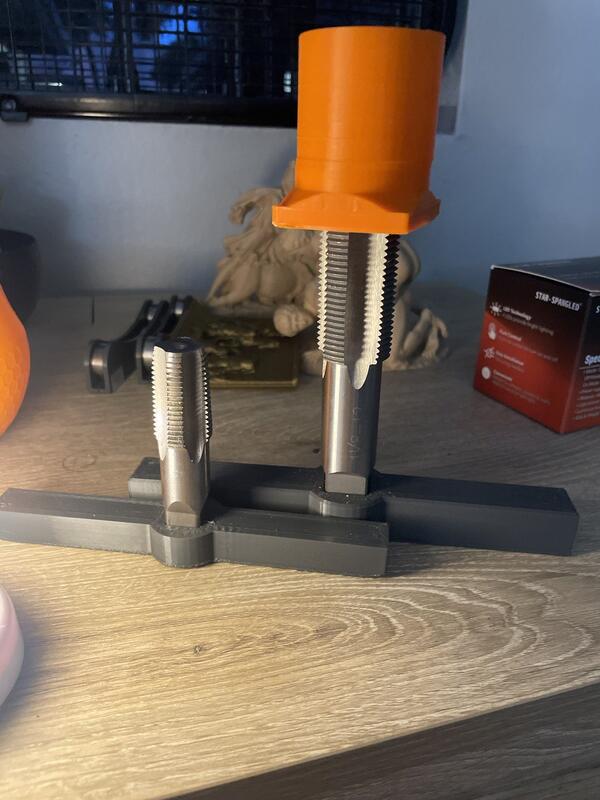 Custom fixture holding NPT taps for threading 3D-printed parts